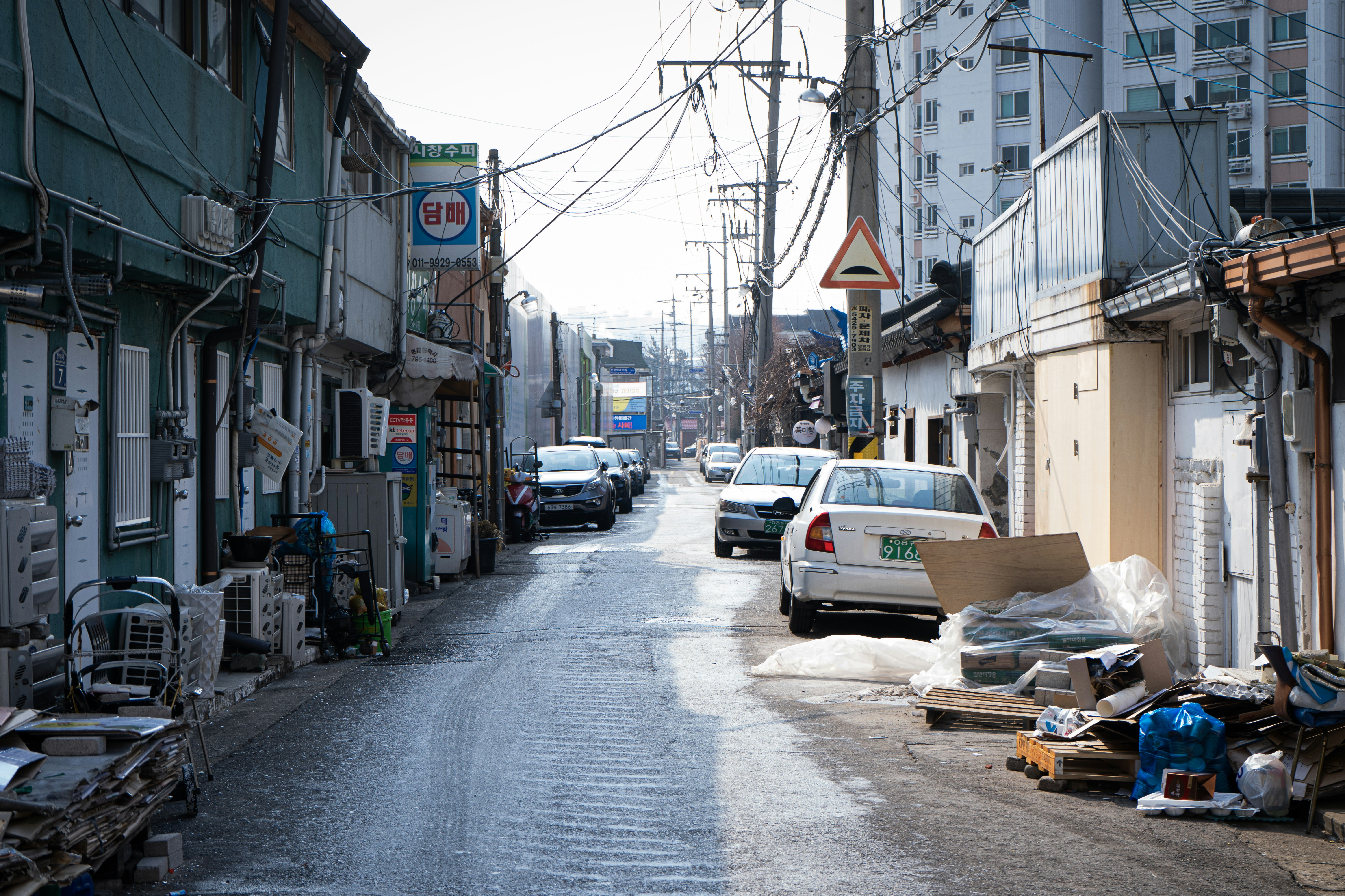 cars parked on side of the road during daytime